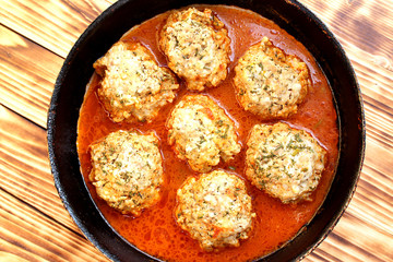Buttermilk meat balls cooked in tomato sauce