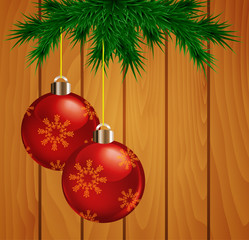 Christmas fir tree branches with red balls.