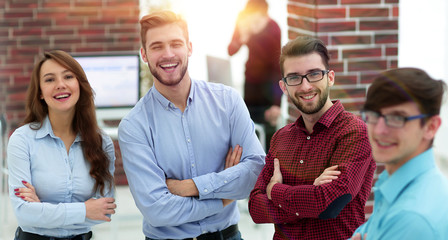 Happy smiling business team in office.