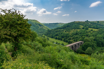 Fototapeta na wymiar Peak District landscape with the Headstone Viaduct over the River Wye in the East Midlands, Derbyshire, England, UK