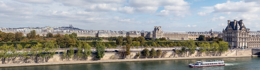 Panoramic view of Paris from Musee d'Orsay rooftop with the Seine, Tuileries Garden, Palais royal,...