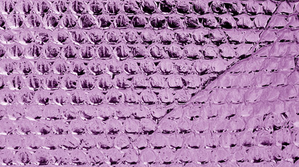 Shiny metal surface in purple tone.