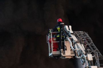 Fototapeta premium firefighters during the action of extinguishing a powerful fire of a recycling company.Poland, Szczecin