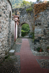 narrow medieval alley with arch, in the town of Levanto, Italy.