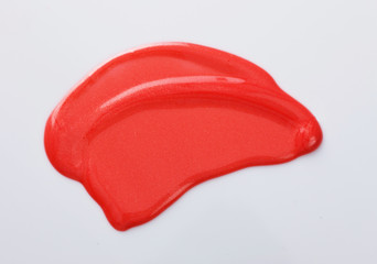Texture of the Red Lipgloss liquid, white background