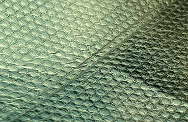 Green color shiny metal surface.