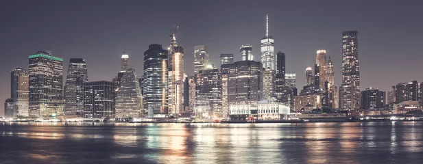 Poster Manhattan skyline at night, color toning applied, USA. © MaciejBledowski
