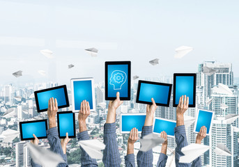 Close of man hands in line showing tablet pc with blank blue scr