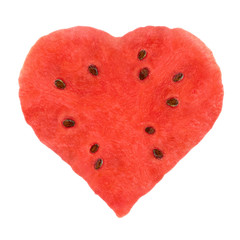 Juicy pulp watermelon in shape of heart on white background