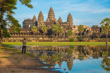 Fototapeta premium The beautiful view of Angkor Wat the massive and largest religion monument in the world at sunset. Located in Siem Reap, Cambodia.