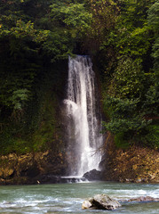 Fototapeta na wymiar Waterfall in the forest on a mountain river, Georgia, Martville canyon