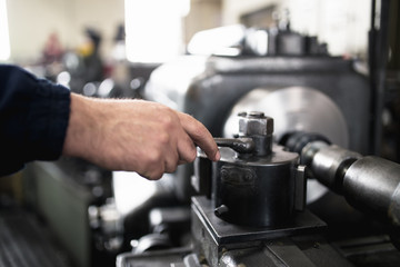 Metallurgy heavy industry. Factory for production industrial machines. Low light close up shot. Short depth of field.