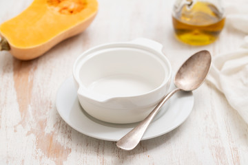 empty soup bowl on white wooden background