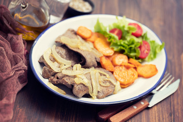 fried liver on white dish and fried sweet potato on plate