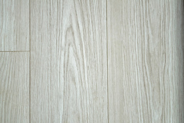 Wood texture with natural pattern. Laminate parquet floor. Light soft wood surface as background, wood texture. Wood planks.