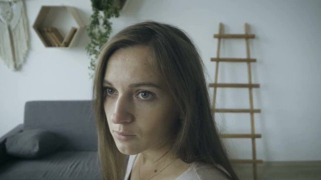 Frightened girl flinches and turns around
