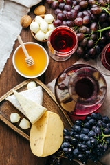 Cheese and wine, Decanter and glasses, wooden background, appetizer, grapes