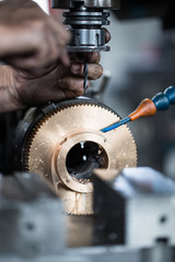 Metallurgy heavy industry. Factory for production industrial machines. Low light close up shot. Short depth of field.