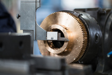Metallurgy heavy industry. Details from factory for production industrial machines. Low light close...