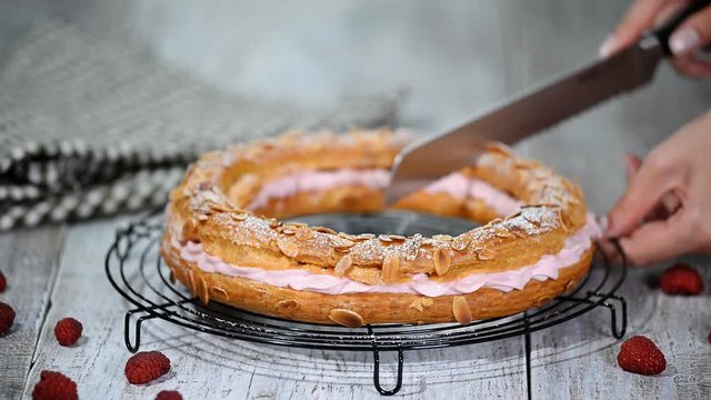 Homemade choux pastry cake Paris Brest with raspberries. French dessert.