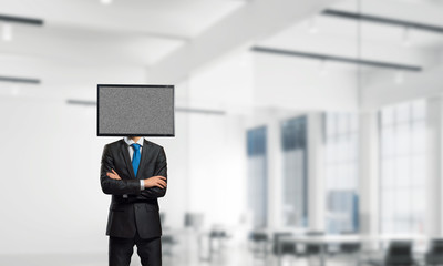 Businessman with TV instead of head.