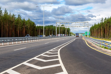 Toll road. Russian highway number M11 in summer day