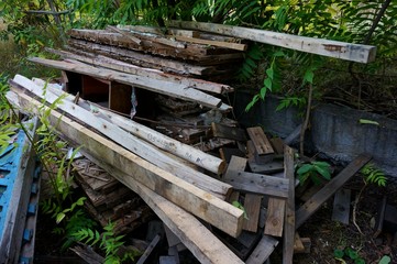 Wooden old planks stacked in the courtyard.