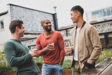 Group of male friends in an outdoor bar