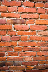 Fragment of an old brick wall close-up.