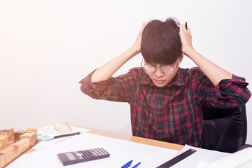 The man sitting stress with work on the table and sunset background