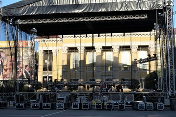 A fragment of an open air concert stage with metal constructions, and spotlights.
