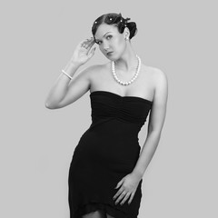 Portrait of a beautiful young girl in black dress