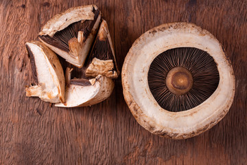 portobello mushrooms over old wood background