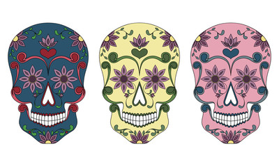 Set of three Mexican skulls on a white background.