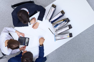 Business people at meeting, view from  above. Bookkeeper or financial inspector  making report,...