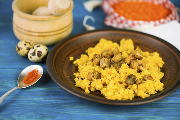 porridge of lentils with fried meat on a plate