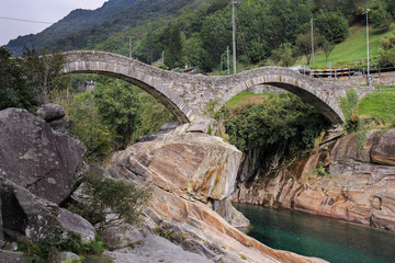 Fototapeta na wymiar Roman stone bridge Ponte dei Salti over Verzasca River, in Lavertezzo valley, Ticino, Switzerland