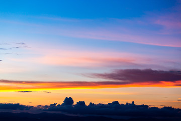 colorful dramatic sky with cloud at sunset.