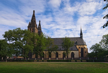 Ancient Neo Gothic Church of Saint Peter and Paul in Vysehrad ("Upper Castle"). Summer landscape photo on a sunny morning. Prague, Czech Republic