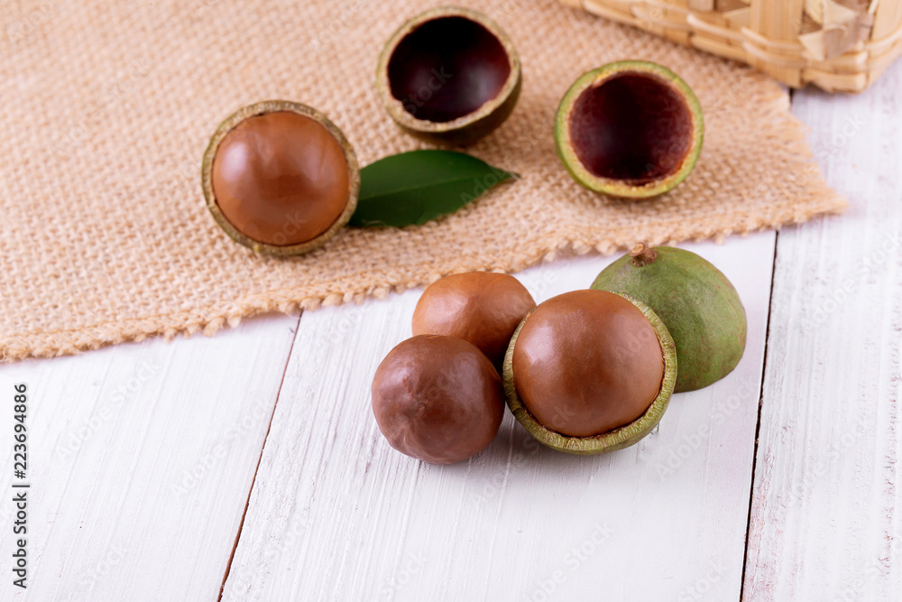 Wall mural organic macadamia nut on wooden table