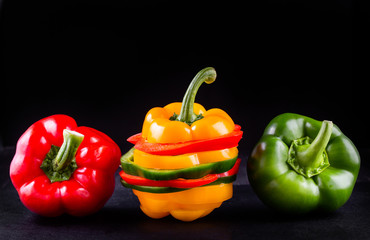 Three sweet peppers on a wooden background, Cooking vegetable salad