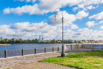 Embankment of the river Volga in Tver, Russia. View of the left Bank of the river. Picturesque clouds in the sky. The Monastery Of St. Catherine.