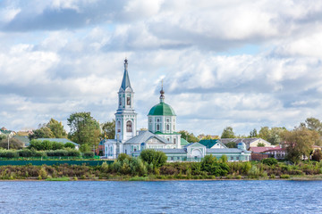 Naklejka premium St. Catherine's convent. Russia, the city Tver. View of the monastery from the Volga river. Picturesque clouds in the sky. Summer or autumn day.