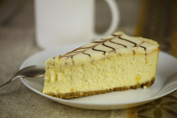 curd cake with cream on a plate