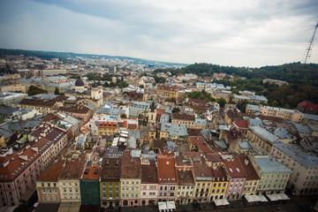 Fototapeta na wymiar Aerial view old european city with rainy clouds on background