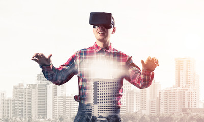 Guy wearing checked shirt and virtual mask stretching hands and 