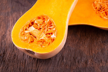 butternut squash over old wood background