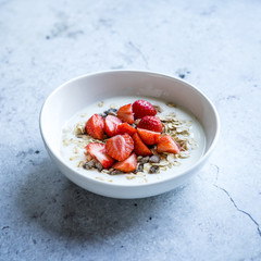 Breakfast bowl with yogurt, muesli and strawberries