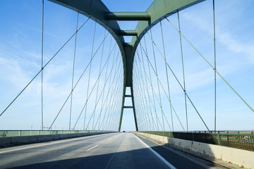 Fehmarn Sound Bridge (German: Fehmarnsundbrücke), suspension bridge with steel arches connecting...