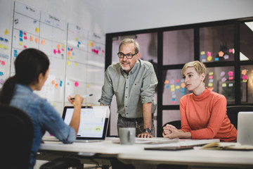 Coworkers working late in an office